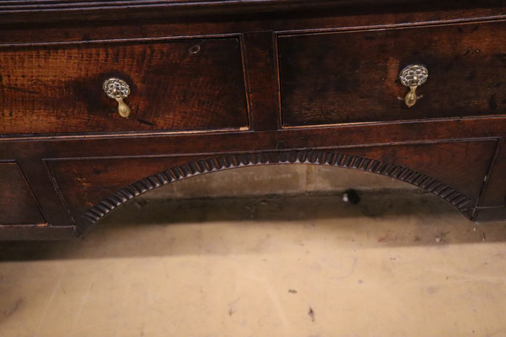 A 19th century oak dresser with open plate rack, width 152cm, depth 41cm, height 181cm